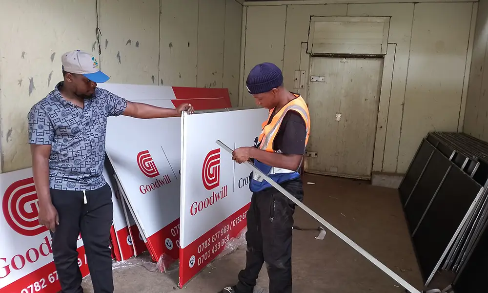 Aluminium cutting measuring and fitting for Goodwill framed PVC signage