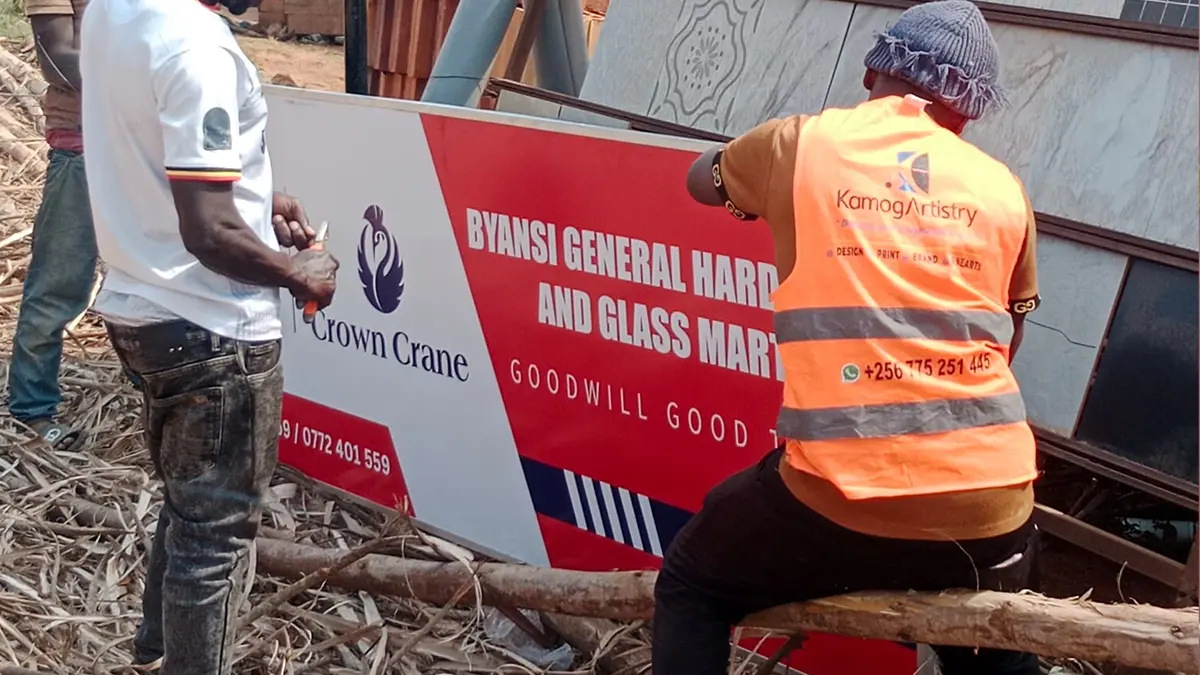 Field team lifting and aligning the framed face at Byansi • Kibiri for the Goodwill and Crown Crane rollout