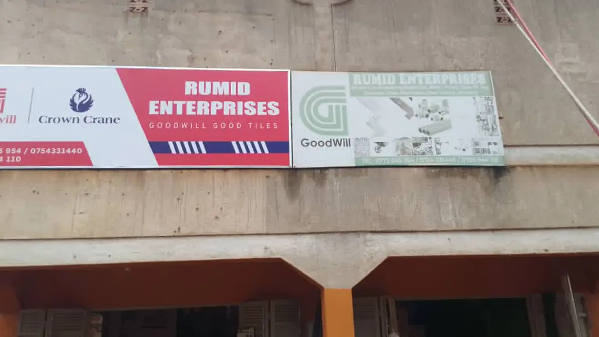 Installed framed signage above the shopfront at Rumid Enterprises • Namasuba for the Goodwill and Crown Crane rollout