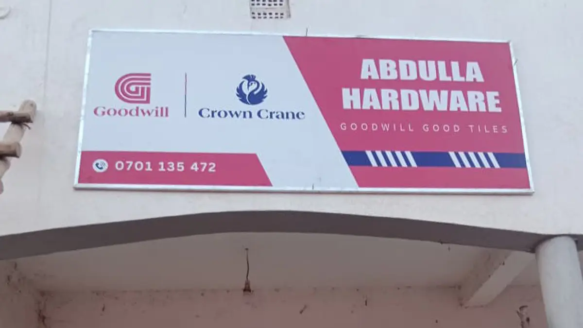 Completed framed signage in position at Abdulla Hardware • Buwalula for the Goodwill and Crown Crane rollout