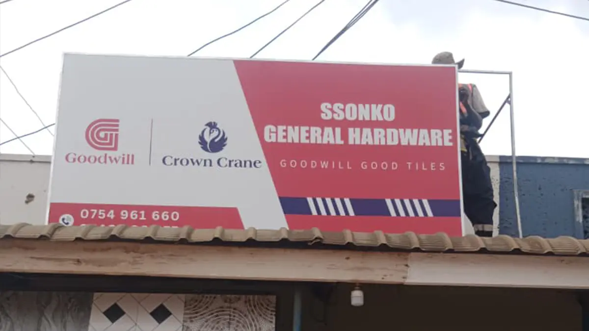 The approved sample being mounted at its final site at Ssonko General Hardware • Mukono for the Goodwill and Crown Crane rollout