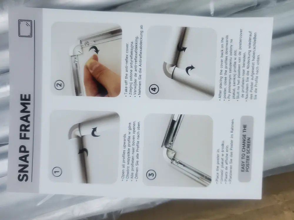 Snapper frame instruction manual showing how artwork can be opened and replaced for future updates.