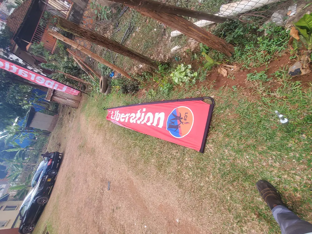 Teardrop banner installation process showing outdoor placement and field readiness.