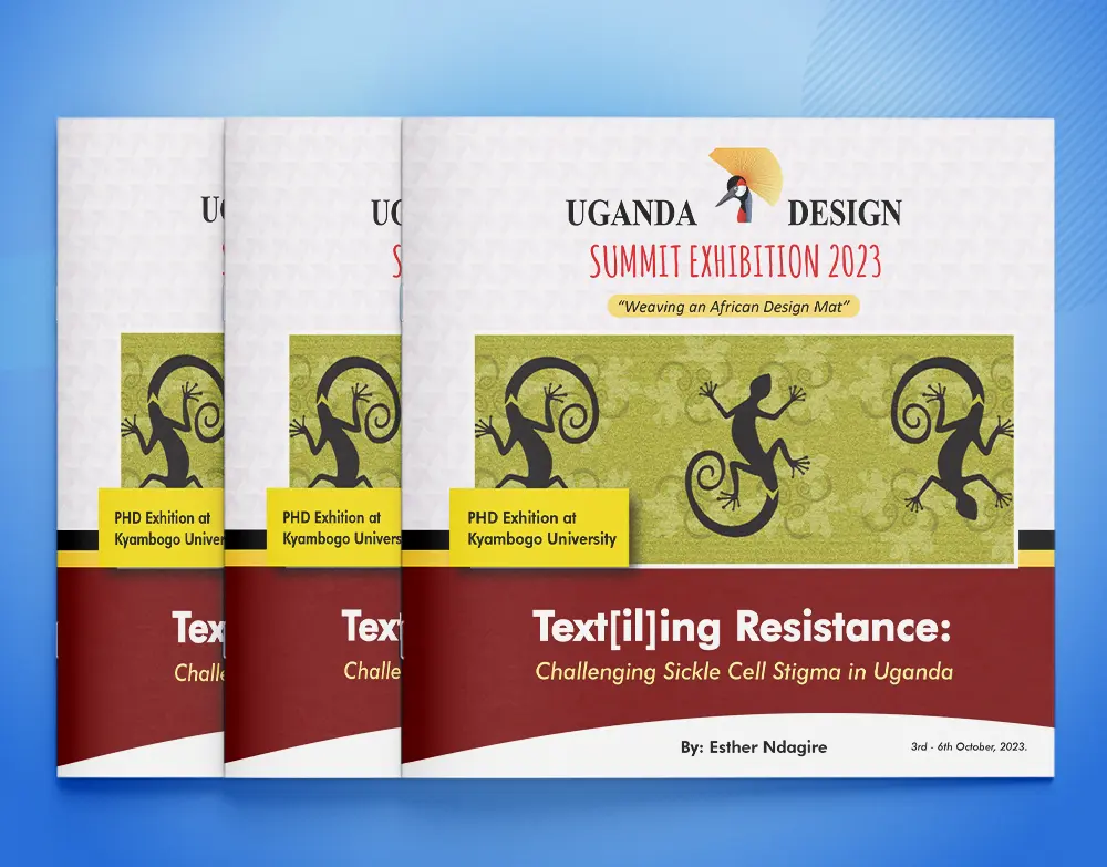 Standing printed set of Uganda Design Summit Exhibition 2025 catalogues showing consistent cover branding
